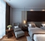 A mobília personalizada do quarto do hotel ajusta a madeira compensada da cama E1 do folheado da noz